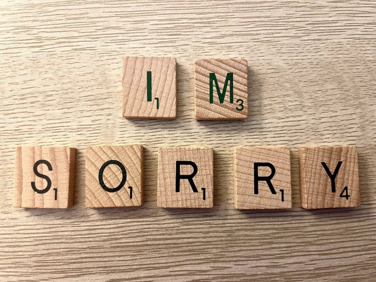 Letter blocks spelling out "I'm Sorry"