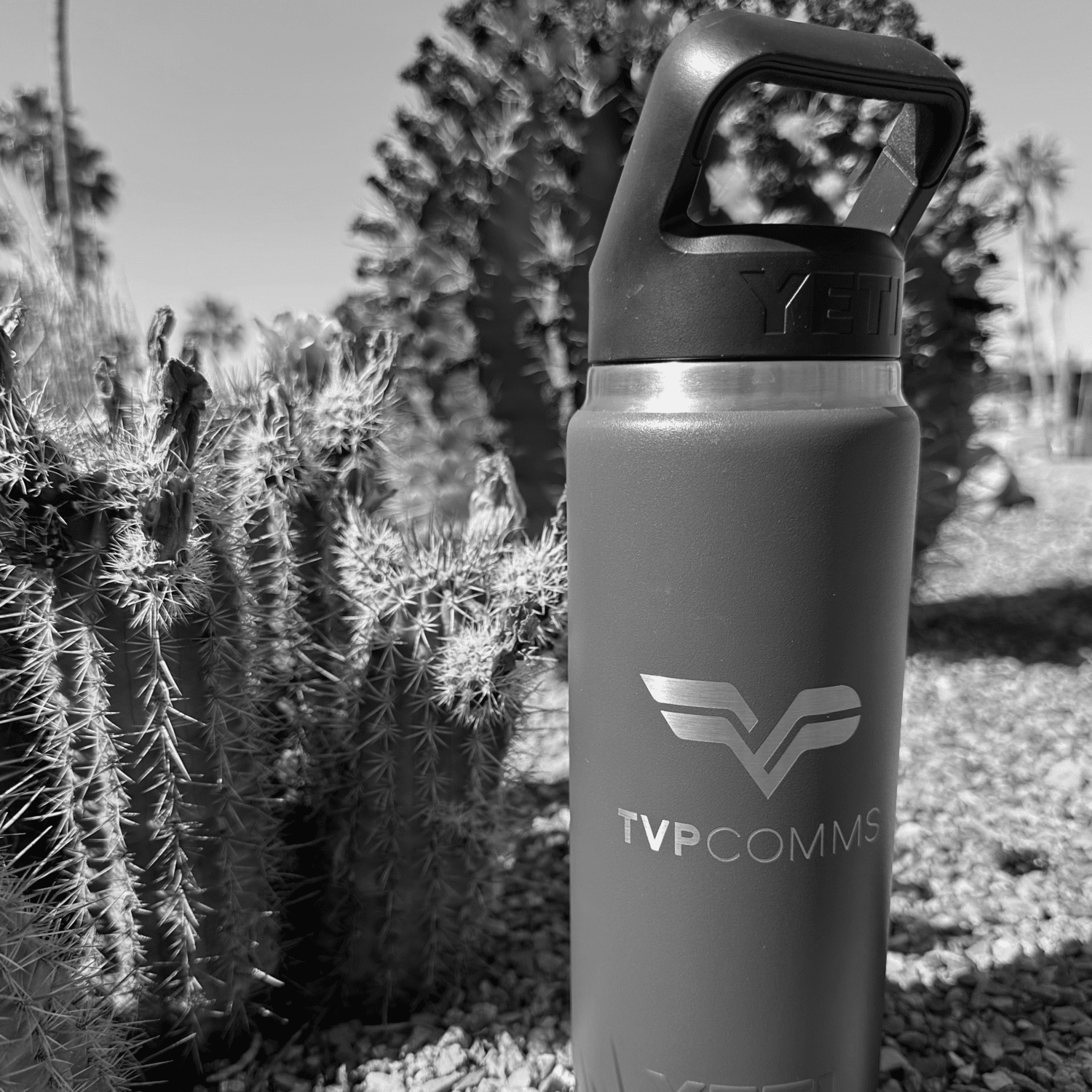 TVP Communications water bottle in the desert