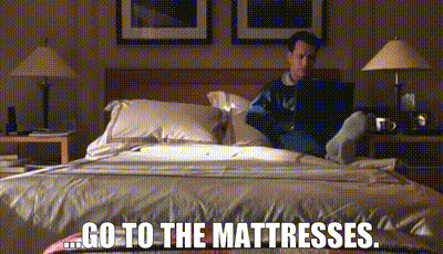 A screenshot of Tom Hanks in "You've Got Mail" has been altered to say "... GO TO THE MATTRESSES"